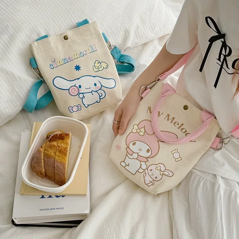 Sanrio Hello Kitty Cinnamoroll อนิเมะ Kawaii INS กระเป๋าผ้าใบแฟชั่นน่ารักเมโลดี้ท่องเที่ยวแบบสบายๆกระเป๋าถือใส่ของของขวัญของเล่น