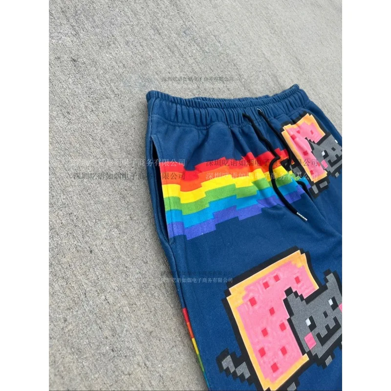 نيان كات بكسل طباعة السراويل الرجال 2025 جديد المتضخم فضفاض الشارع الشهير قوس قزح نمط بناطيل كاجوال Harajuku موضة مريحة