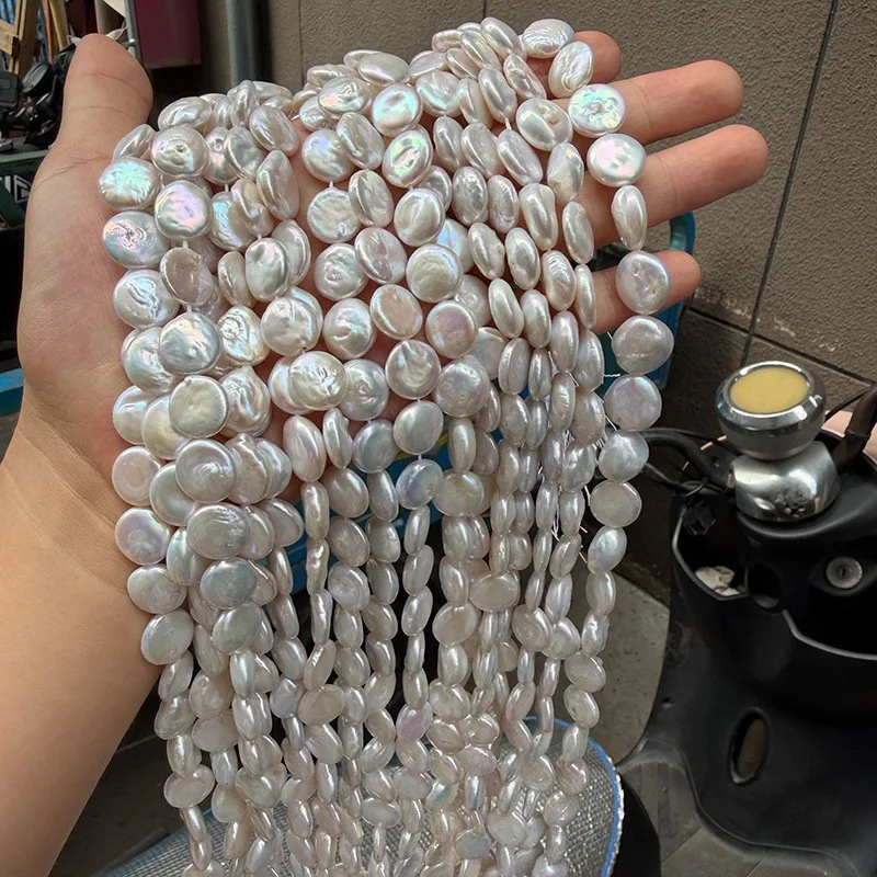 12-13mm iridescent button-style Baroque pearl coin beads, natural freshwater, one strand 39cm, approximately 28 pieces.