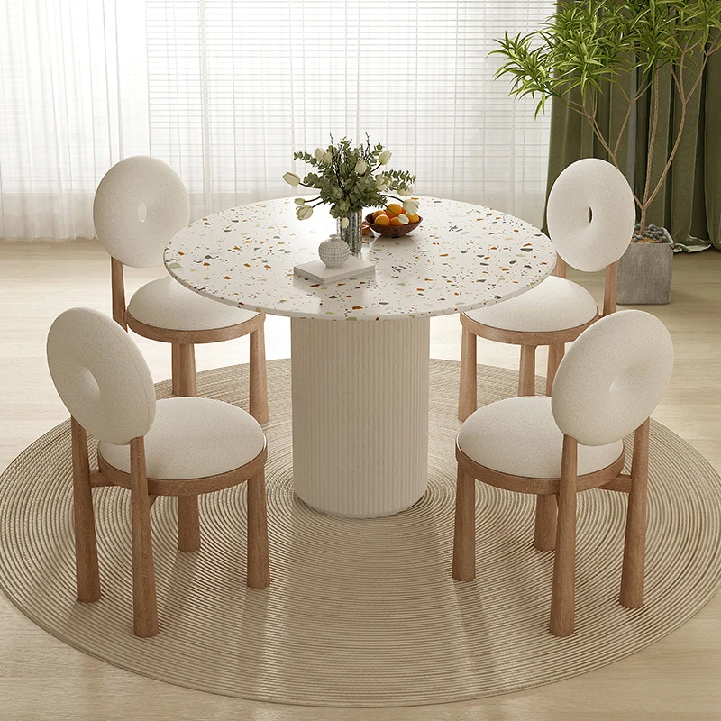 The combination of dining table and chair on the rock plate is a modern, advanced sense of round table for household use.