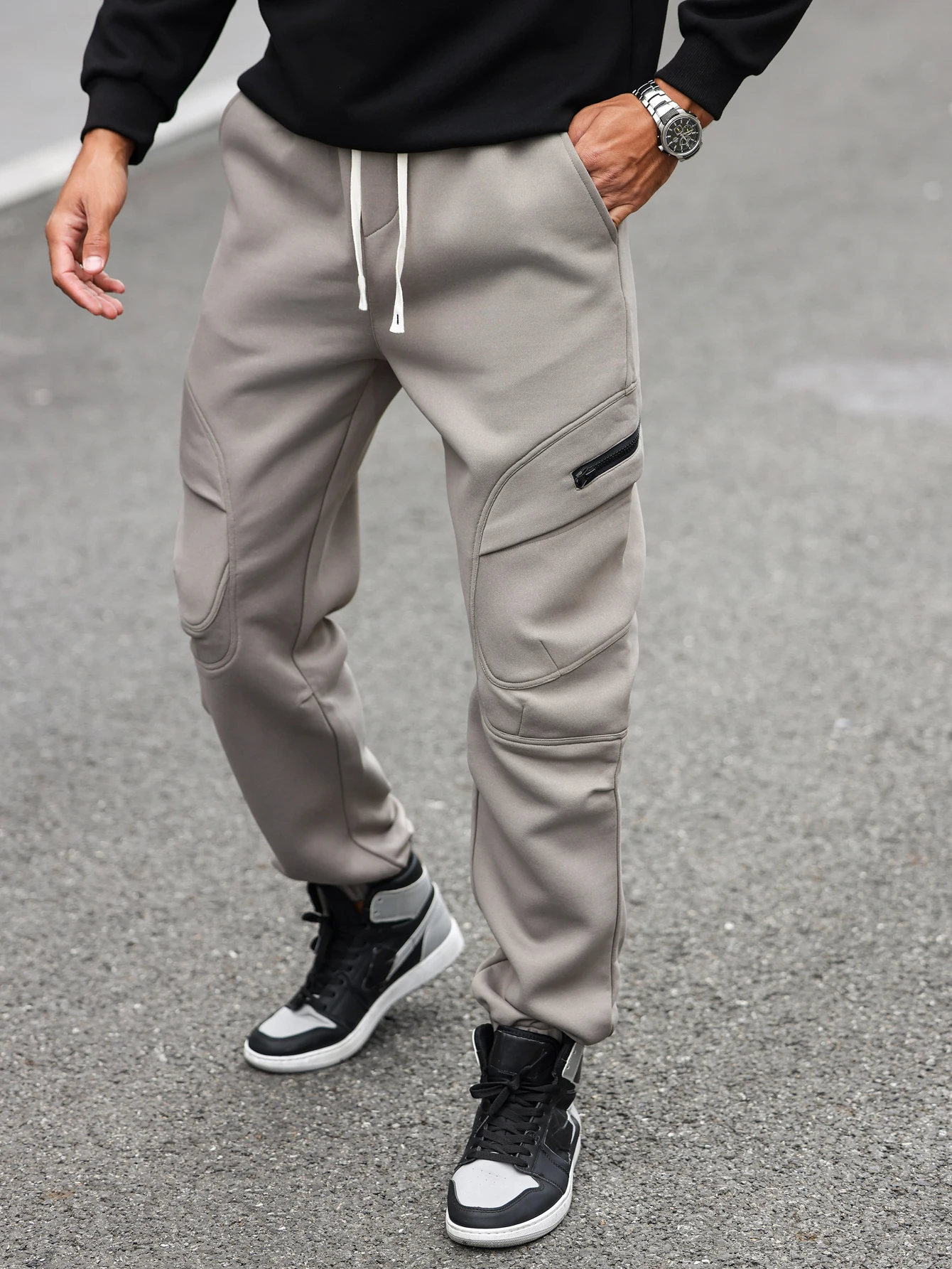 Men's and women's jogger pants with tapered cuffs, irregular pockets, zipper design, loose fit, casual sportswear, street style,