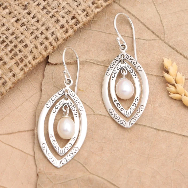 Ethnic style double-layer elliptical frame relief pattern combined with imitation pearl ladies' pendant earrings for parties