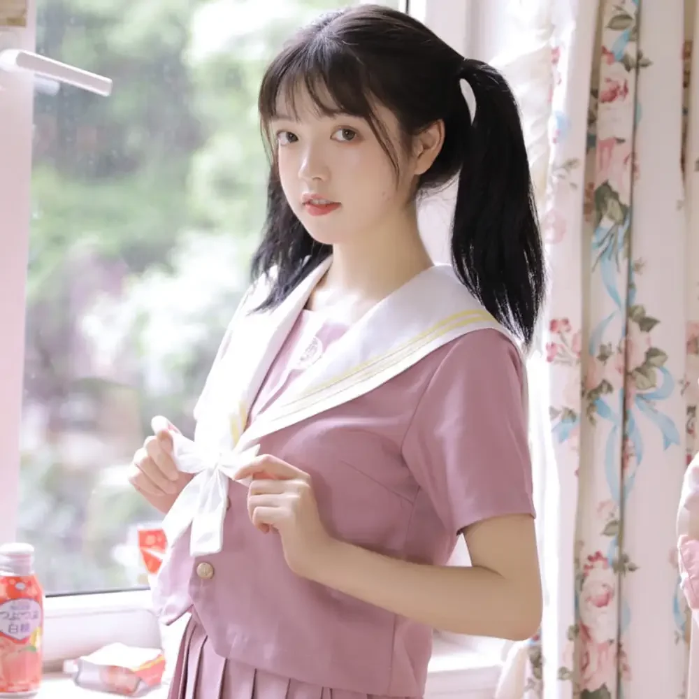 Set uniforme per ragazza scolastica coreana e giapponese Set di orchidee di giada rosa Abito Jk di base Gonna a pieghe Sailor Club Anime COS Costumi da donna