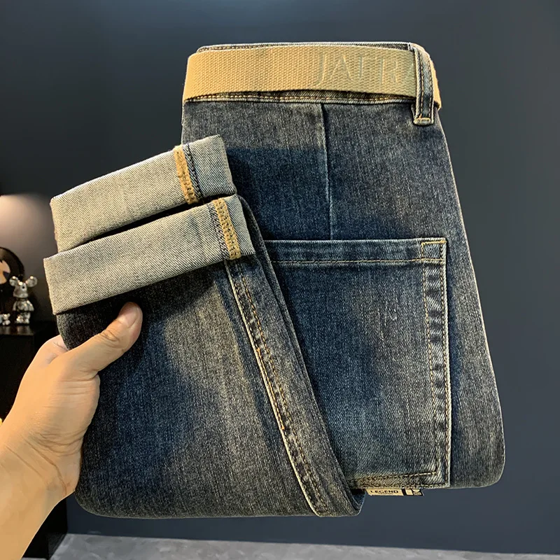 جينز جديد غير رسمي بجيب مائل لعام 2025 للرجال، سروال خريفي متعدد الاستخدامات وقصة ضيقة وتنحيف مدبب بأرجل صغيرة