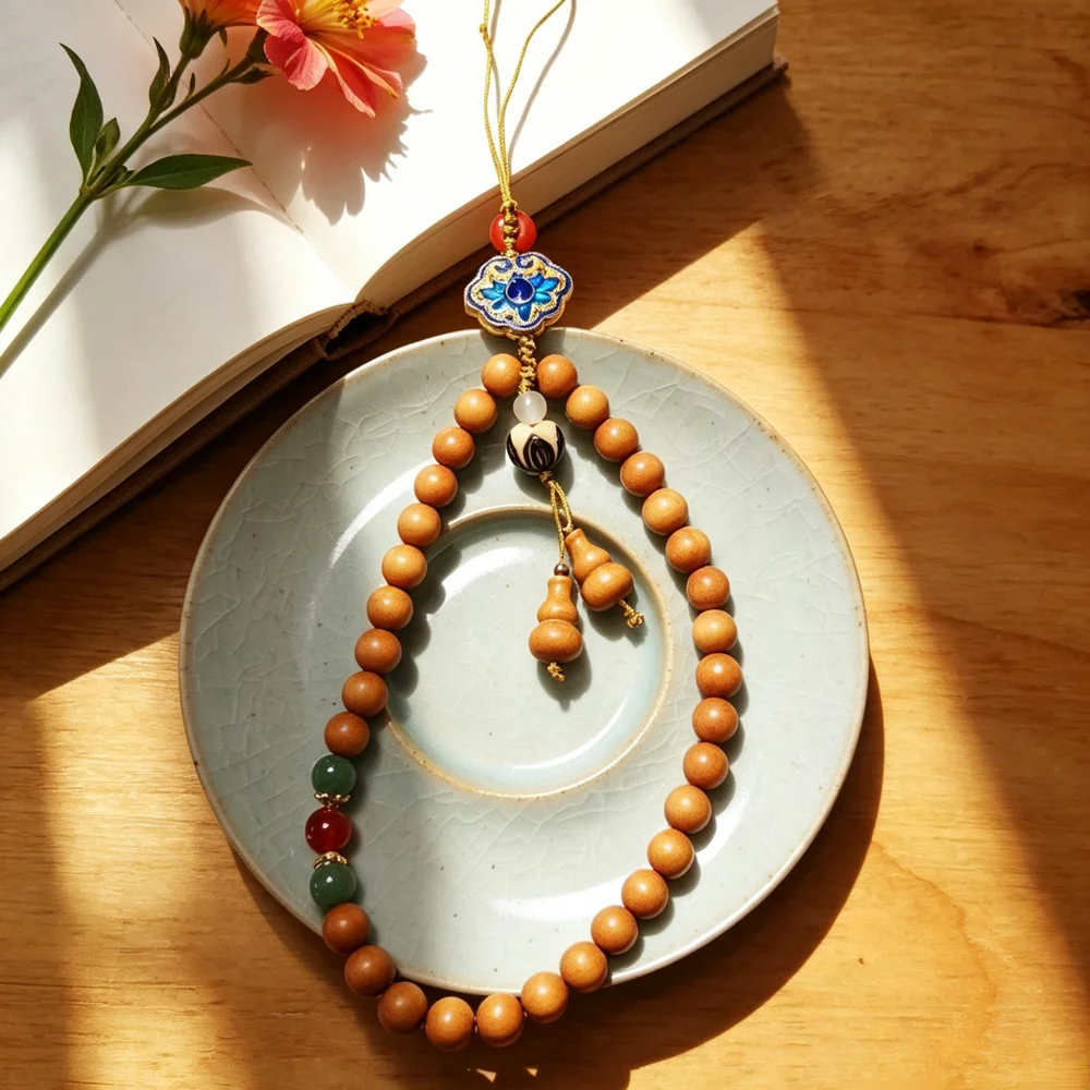 Auspicious Sandalwood Bead Phone Strap & Keychain – Blue Enamel Baoxiang Flower Metal Charm, A Fragrant Blessing for Everyday