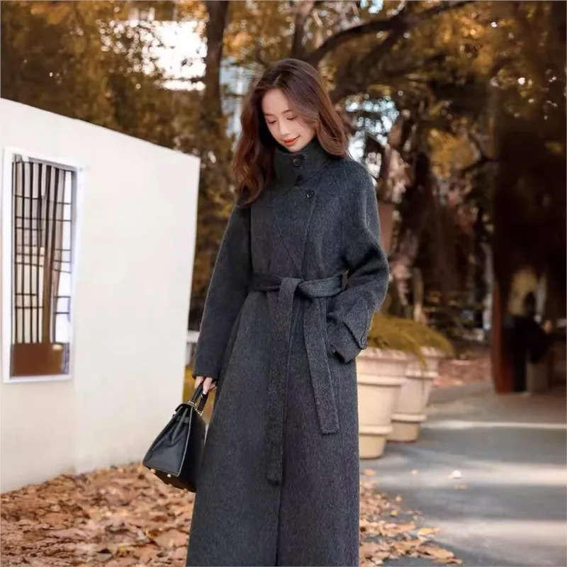 

A new long and elegant double-sided tweed coat for women with cinched waist