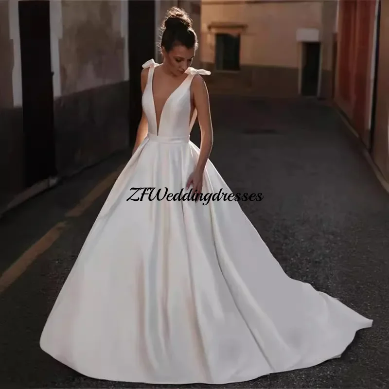 CustomizedTwo Bows Deep V Neck Satin A Line Wedding Dress Open Backless Sweep Train Bridal Gown