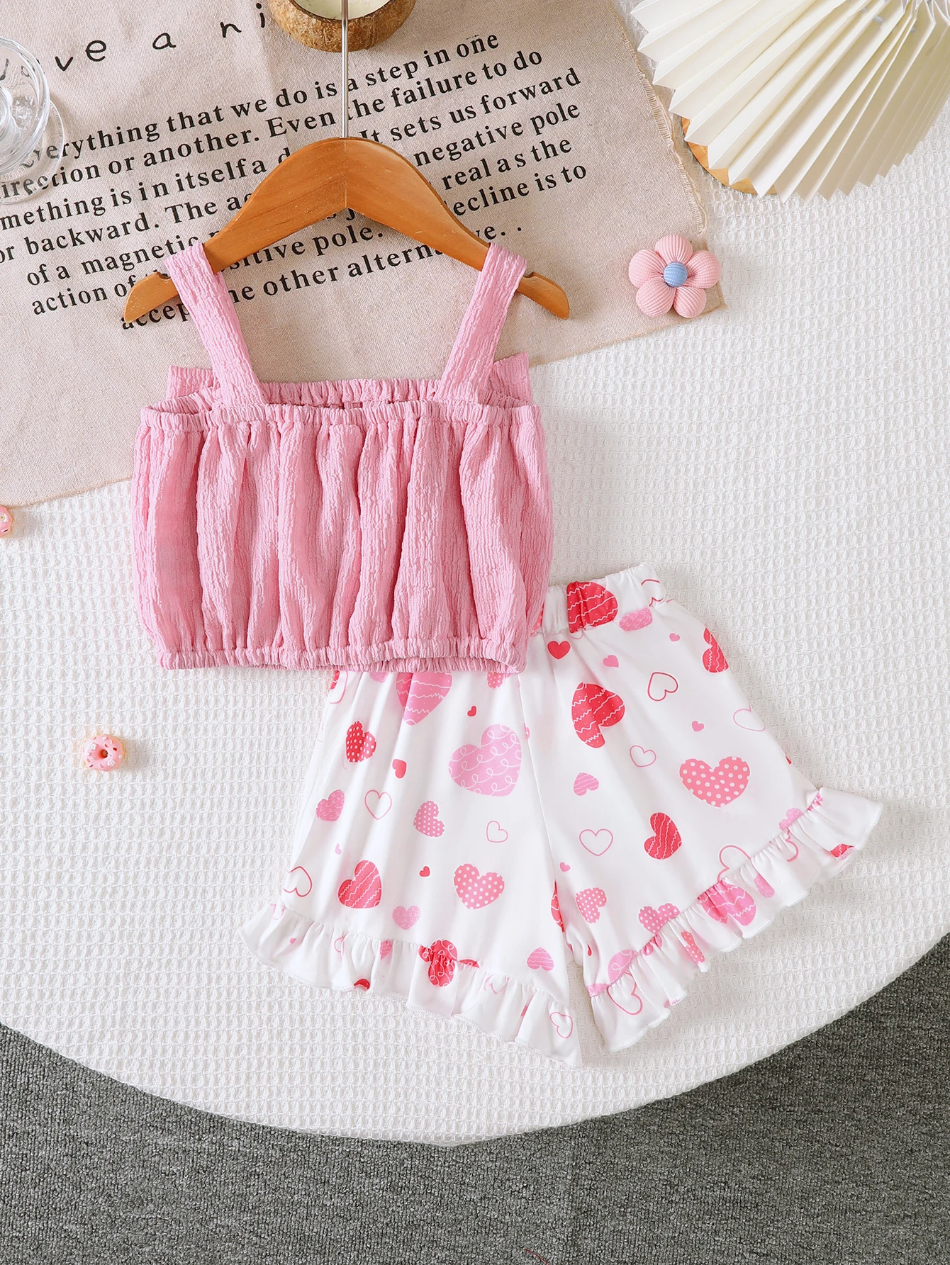 Girls' Summer Sweet Bow-Knot Two-Piece Set, Short Top with Pleated Texture Paired with Shorts with All-Over Heart Print, Loose and Comfortable Fit, Suitable for Daily Outings and Leisure Activities, Cute and Stylish Summer Outfit for Little Girls.