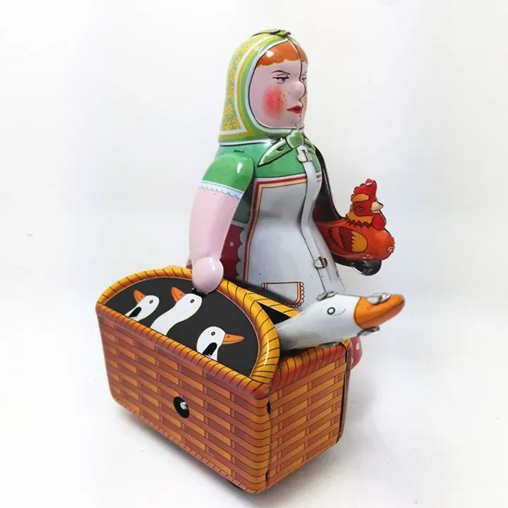 [Funny] [New] Classic collection Retro Clockwork Wind up Metal Walking Tin farmer robot woman with the goose Mechanical toy gift