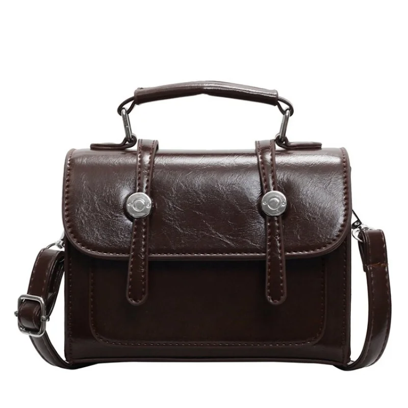

Elegant Women Handbag With Structured Box Design And Top Handle Polished Sophisticated