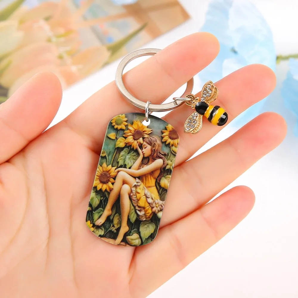 Sunflower Girl Stainless Steel Keychain Born in The Sun Metal Bag Decorations Oil Painting Girl Engraved Bag Pendant