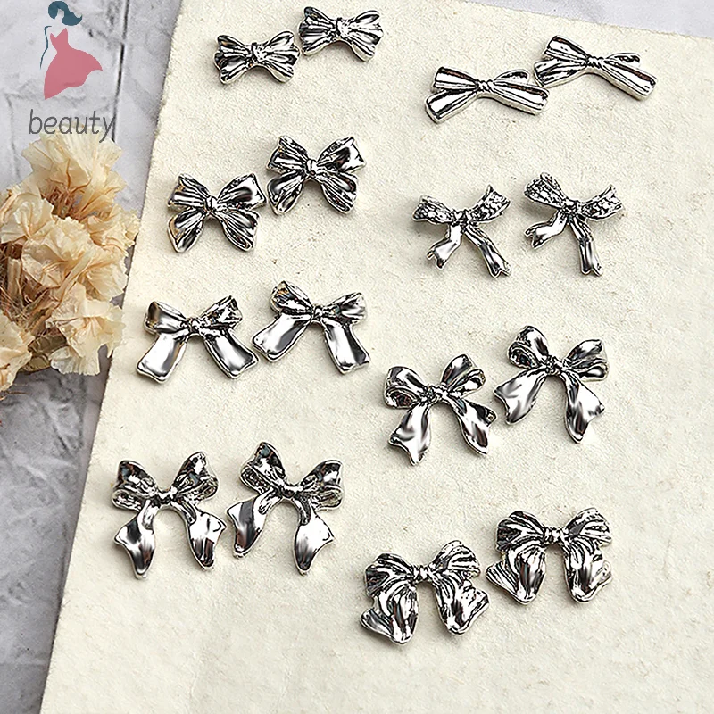 10 szt. Karuzeli do paznokci Bowknot Metal 3D ozdoby do paznokci srebrzysty akcesoria ze stopów Manicure Rhinestone diamentowa biżuteria Salon artystyczny do paznokci