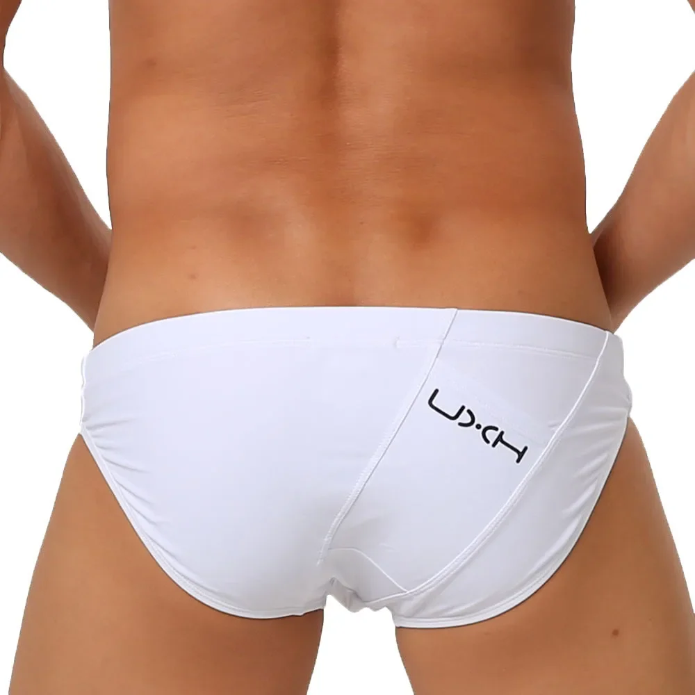 Calzoncillos de baño para hombre, ropa de baño Sexy con bolsillos de parche blanco y negro, pantalones cortos deportivos para agua y playa