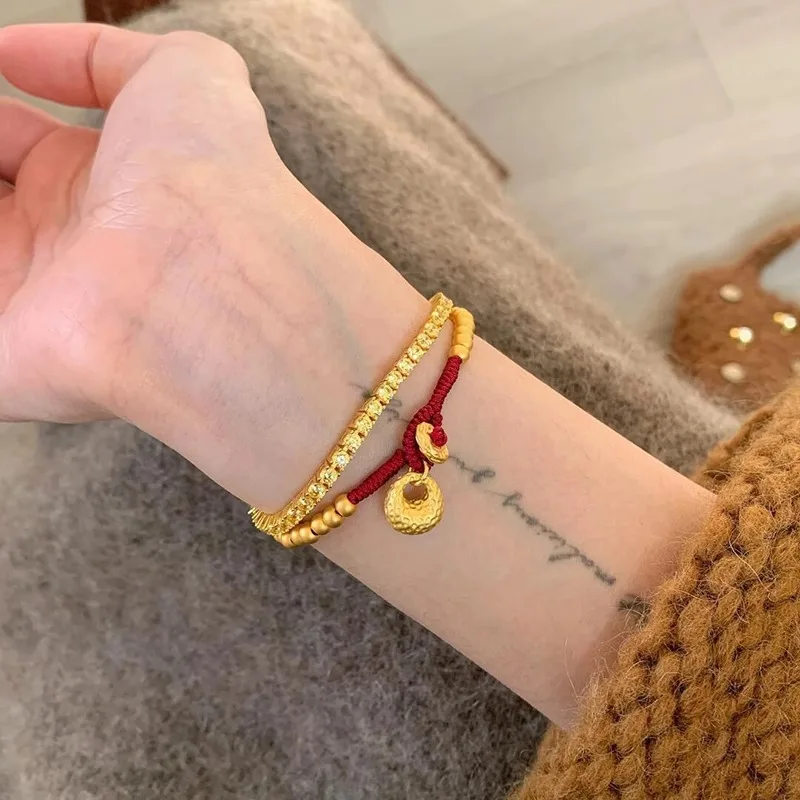 New in antique gold crafts round beads Yuanbao style bracelets red woven rope bag bracelet light luxury simple banquet jewelry view 6