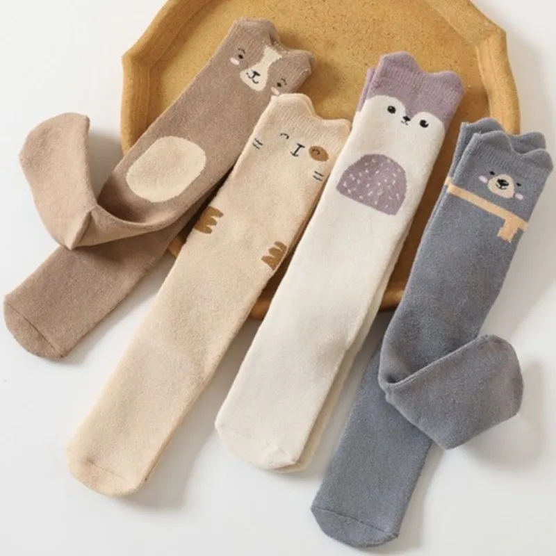 ถุงเท้าเด็กหนาสำหรับฤดูหนาว ถุงเท้าเทอร์รี่แบบยาวถึงเข่า สำหรับเด็กแรกเกิด ให้ความอบอุ่น ทรงหลวม ดีไซน์น่ารัก กันลื่น