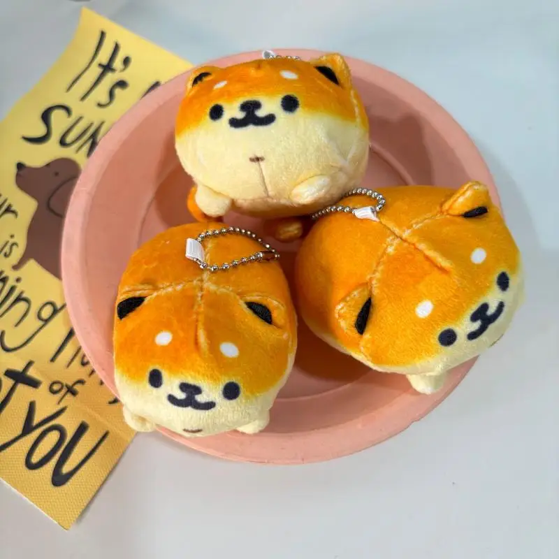 พวงกุญแจตุ๊กตาหมาขนมปังน่ารัก 1 ชิ้น ตุ๊กตาผ้าเนื้อนุ่ม ของตกแต่งกระเป๋าเป้สะพายหลัง พวงกุญแจรถยนต์ ของขวัญสำหรับเด็ก