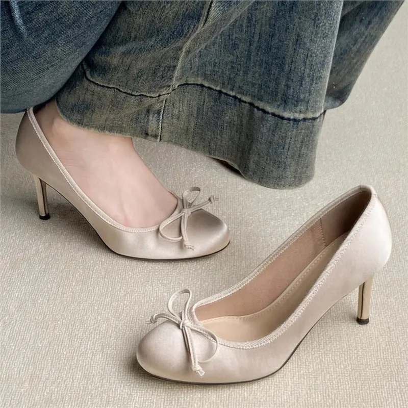 

French-style Mary Jane shoes with a small bow pointed round toe fine stiletto heel suitable for wearing with dresses