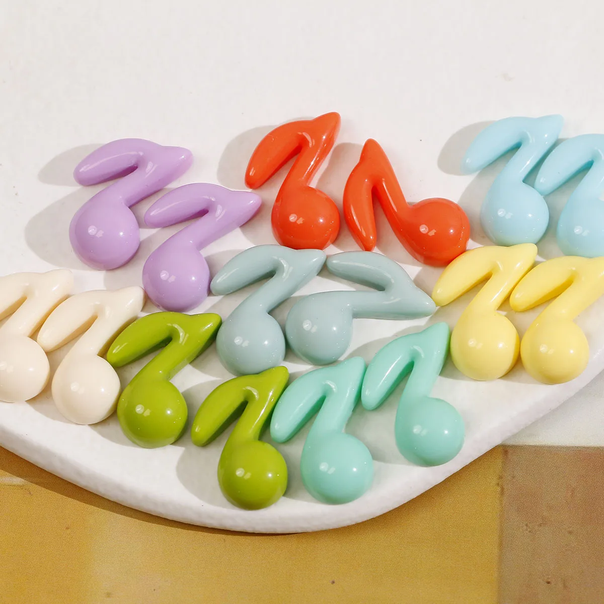 

Wholesale 100pcs 24*18mm Flatback Solid Pastel Colors Musical Logo Shape Resin Cabochons Ornament Accessory Material Cameo Patch