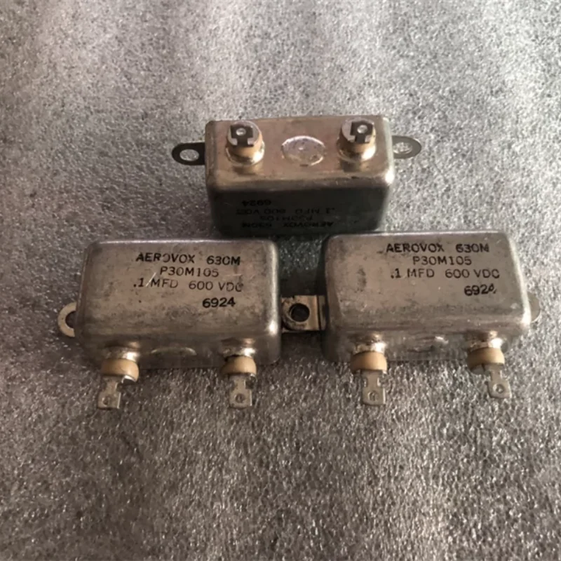 

Антикварная американская машина для желчного пузыря AEROVOX 0,1 мкФ 600 В с медным корпусом, связанная с бесконечным конденсатором, погружным масляным