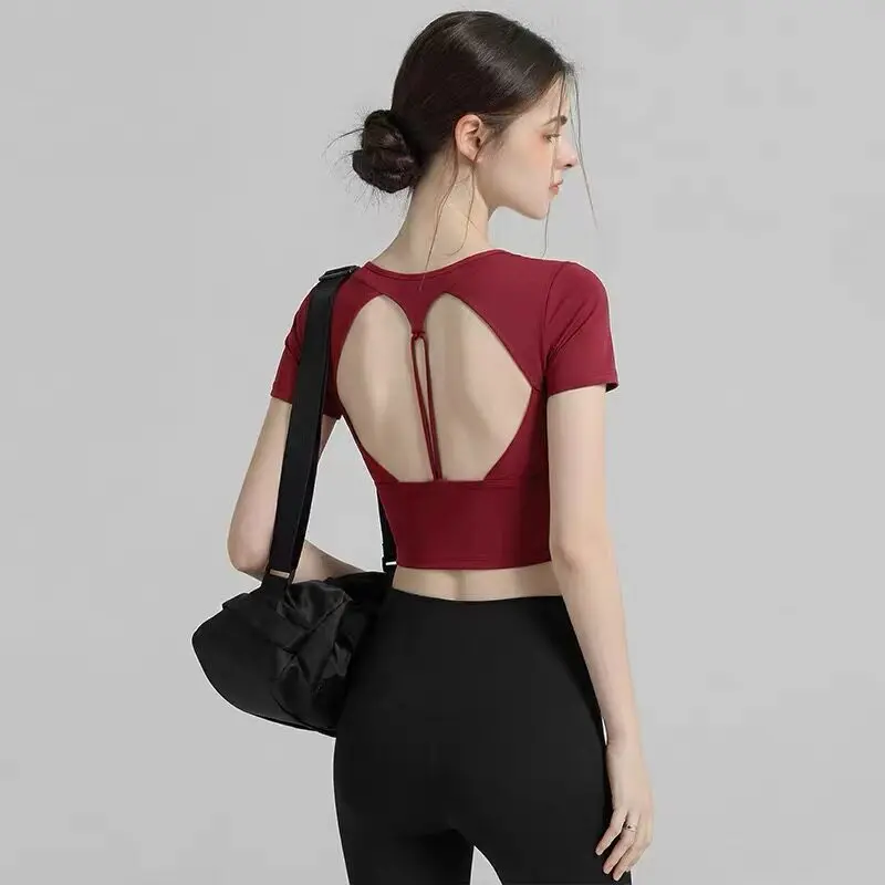 

Новая спортивная одежда для женщин: футболки с коротким рукавом для йоги, фитнеса, пилатеса, бега, с вырезом на спине, верхняя одежда для женщин