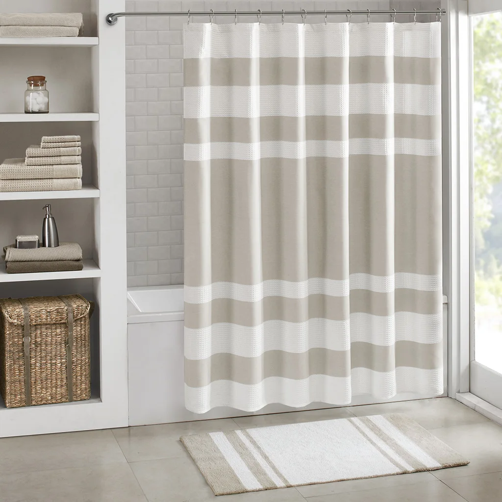 

Medium pile cotton reversible bath rug with non-slip backing in taupe, 20 inches wide by 30 inches long