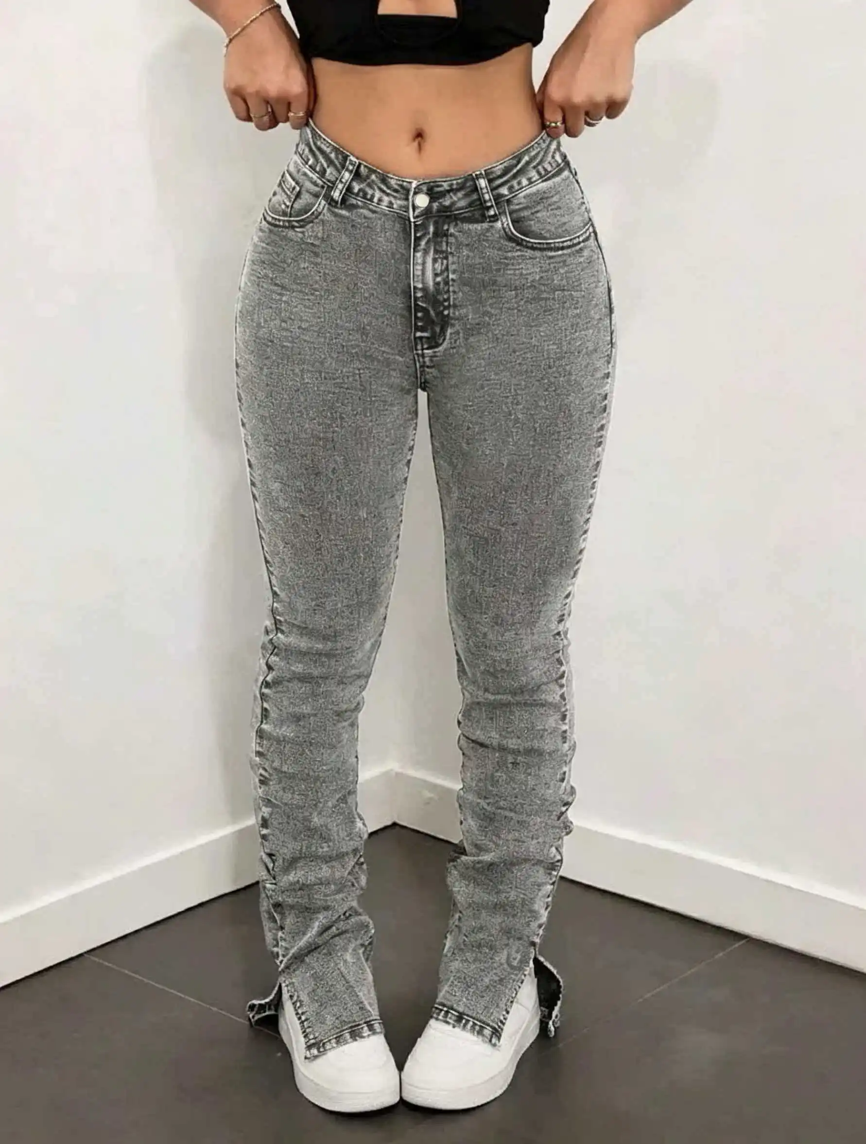 

Grey high-waisted stretch denim jeans for women, stacked jeans with slit hems to elongate the legs