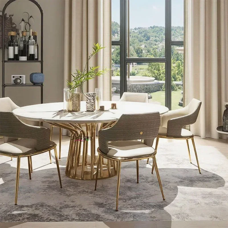 Mesa de comedor italiana y silla, combinación ligera de lujo, mesa redonda de mármol de alta gama, comedor moderno de acero inoxidable de alta gama para el hogar