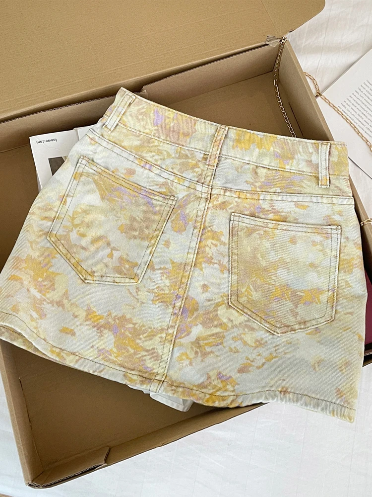 Novo coreano tie dye pintura a óleo impressão cintura alta a linha emagrecimento temperamento versátil meio corpo denim saia curta 2025