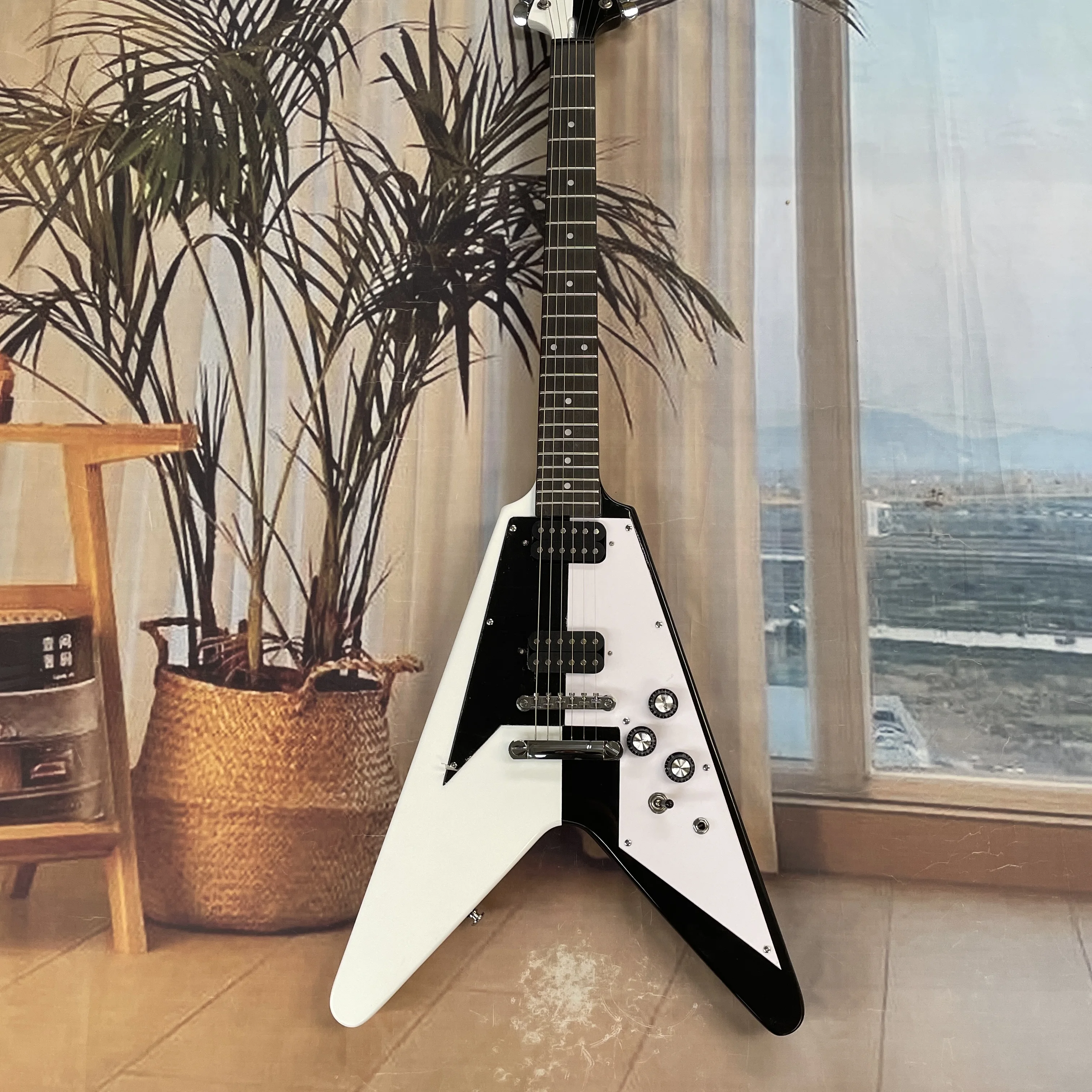 

Black and white contrast V-shaped electric guitar, high-gain metal tone guitars, high cost performance and easy-to-play guitarra