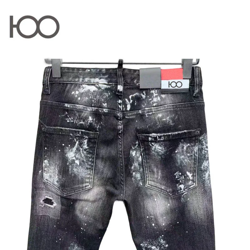 100 C096 Jeans with slim fit, vintage wash, distressed holes with frayed edges, paint splatters – a trendy cool punk style.