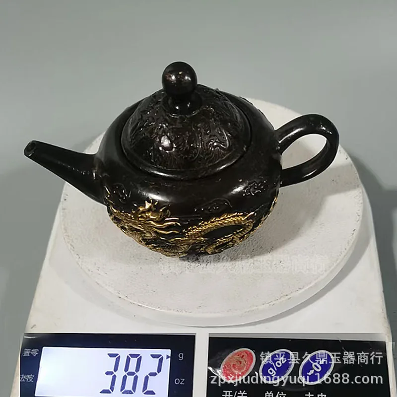 Antique bronzeware collection: gilded , dragon phoenix teapots, small bronze , and wine pots depictin