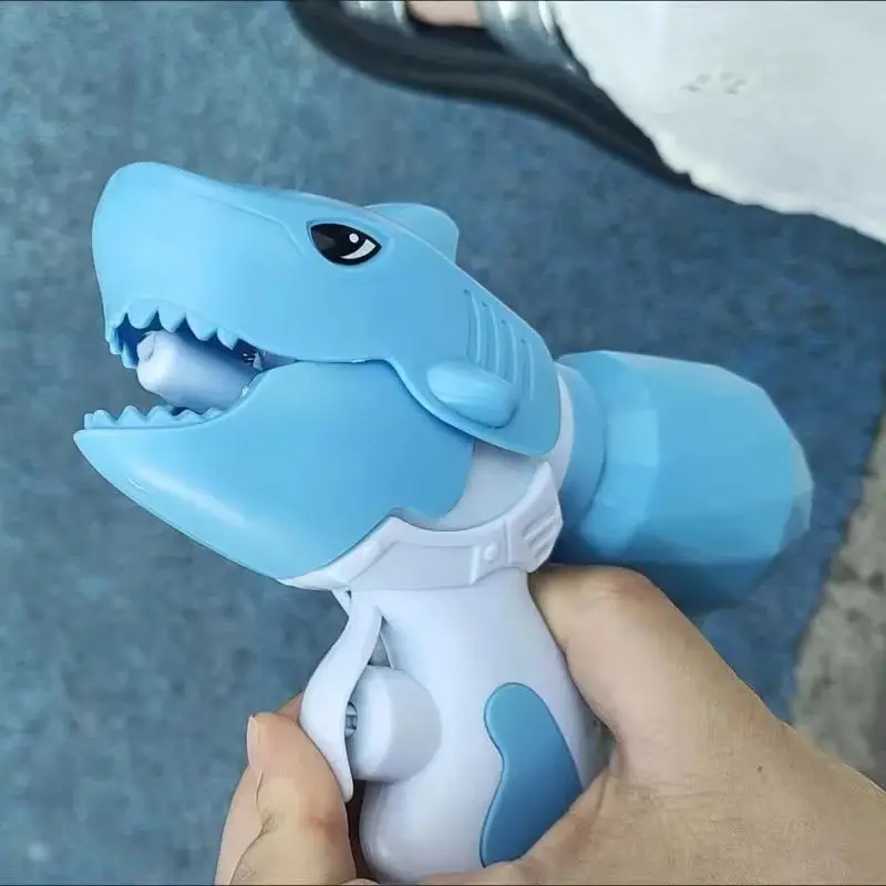 Mini dinosauro squalo pistola ad acqua piscina estiva giocattoli da spiaggia pistola giocattolo per bambini spruzzi d'acqua festival pistola ad acqua spray