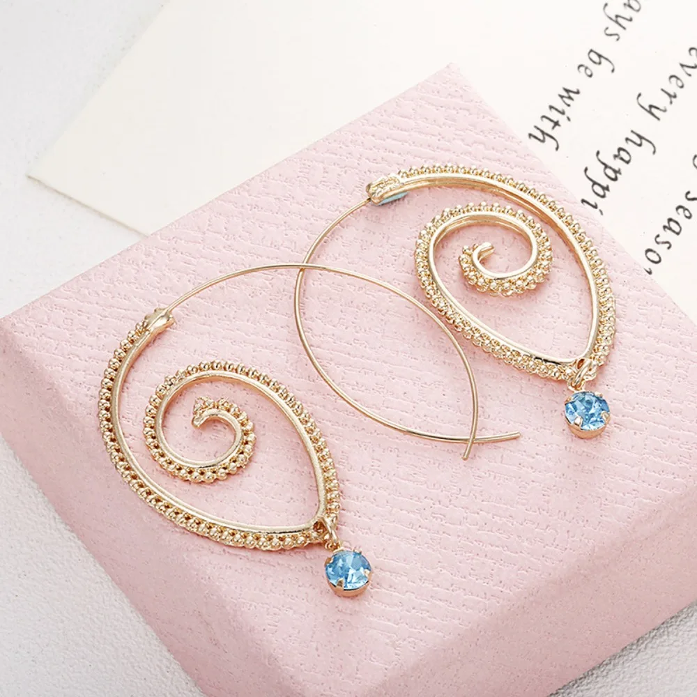 1 pair Fashion spiral earrings featuring exaggerated vortex-shaped green diamonds and retro-style ear accessories