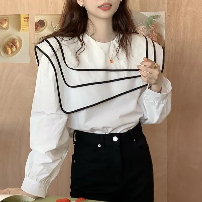 

Korean Autumn Niche Foreign Style Contrasting Color Hemming Three-layer Navy Collar Irregular Design Loose Long-sleeved Shirt