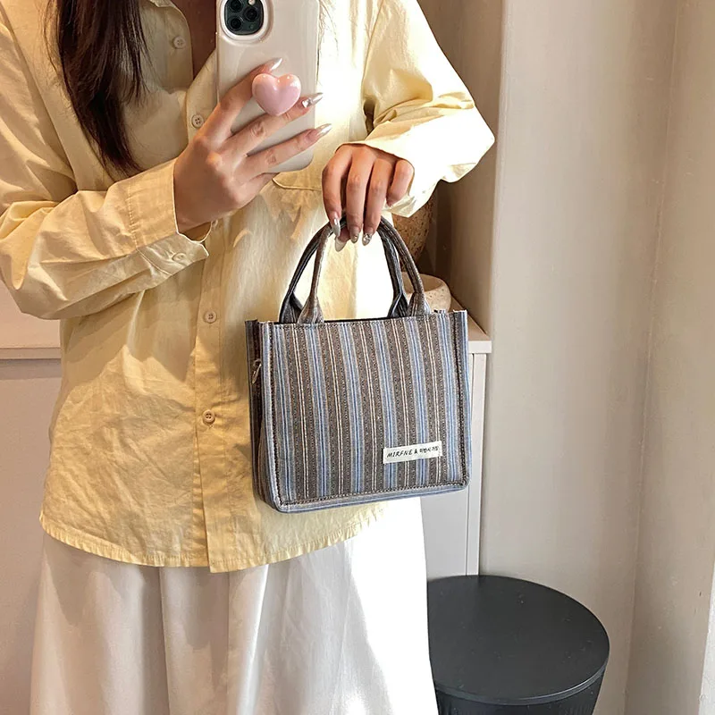 2024 New women\'s shoulder bag Square bag Fashion matching color striped pattern Delicate compact high-end design Mom Female girl