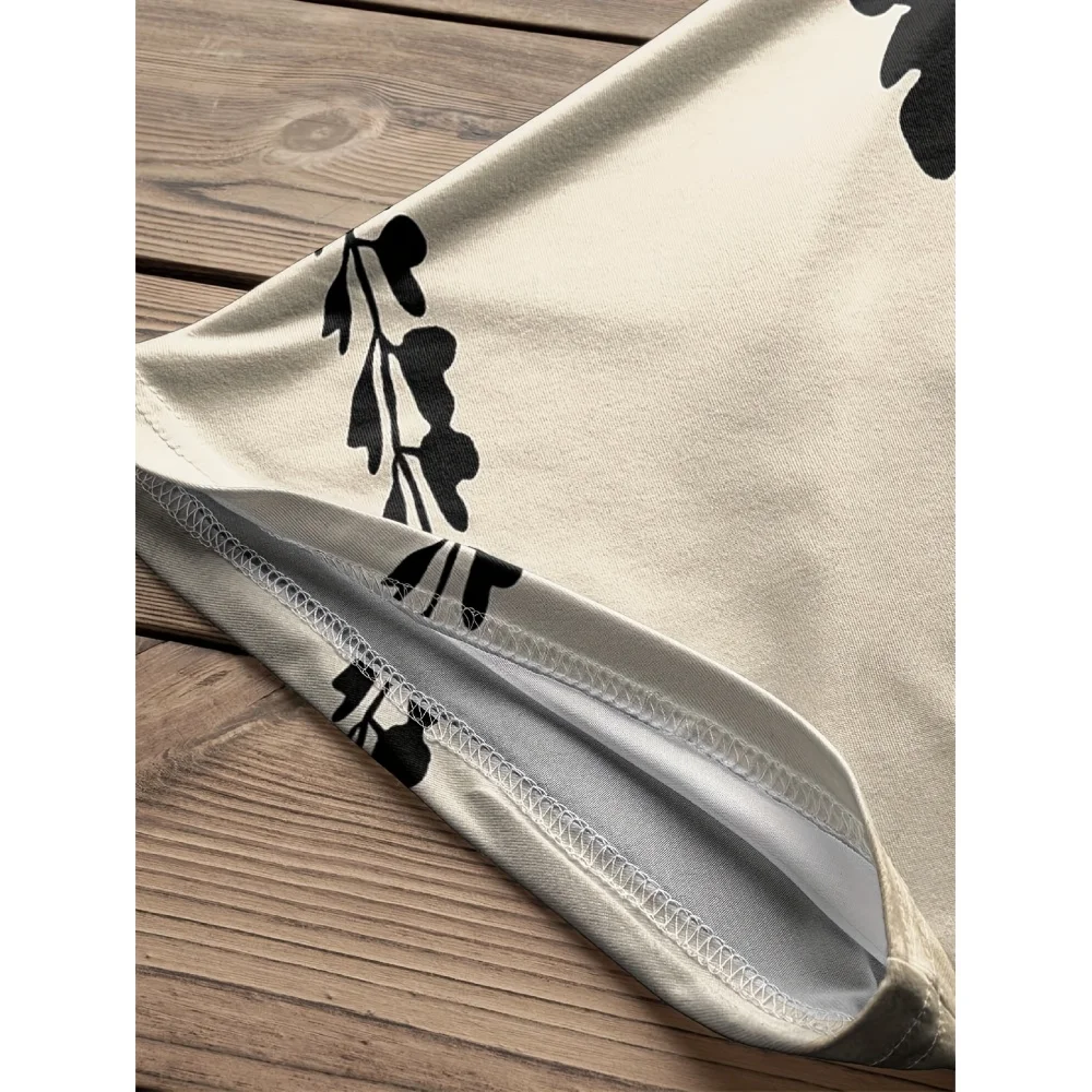 เสื้อทูนิคโบฮีเมียนสำหรับผู้หญิง |   ดีไซน์ลายดอกไม้สีดำและสีขาวหรูหรา รอบคอ ชายกระโปรงพลิ้วไหว เหมาะสำหรับสไตล์ลำลองหรือวันหยุด