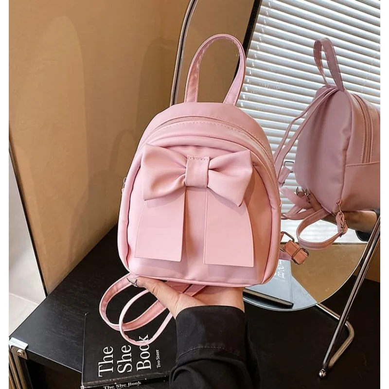 귀여운 리본 백팩 여성 패션 소형 숄더백 심플한 디자인 캐주얼 다용도 여행 팩(핑크)