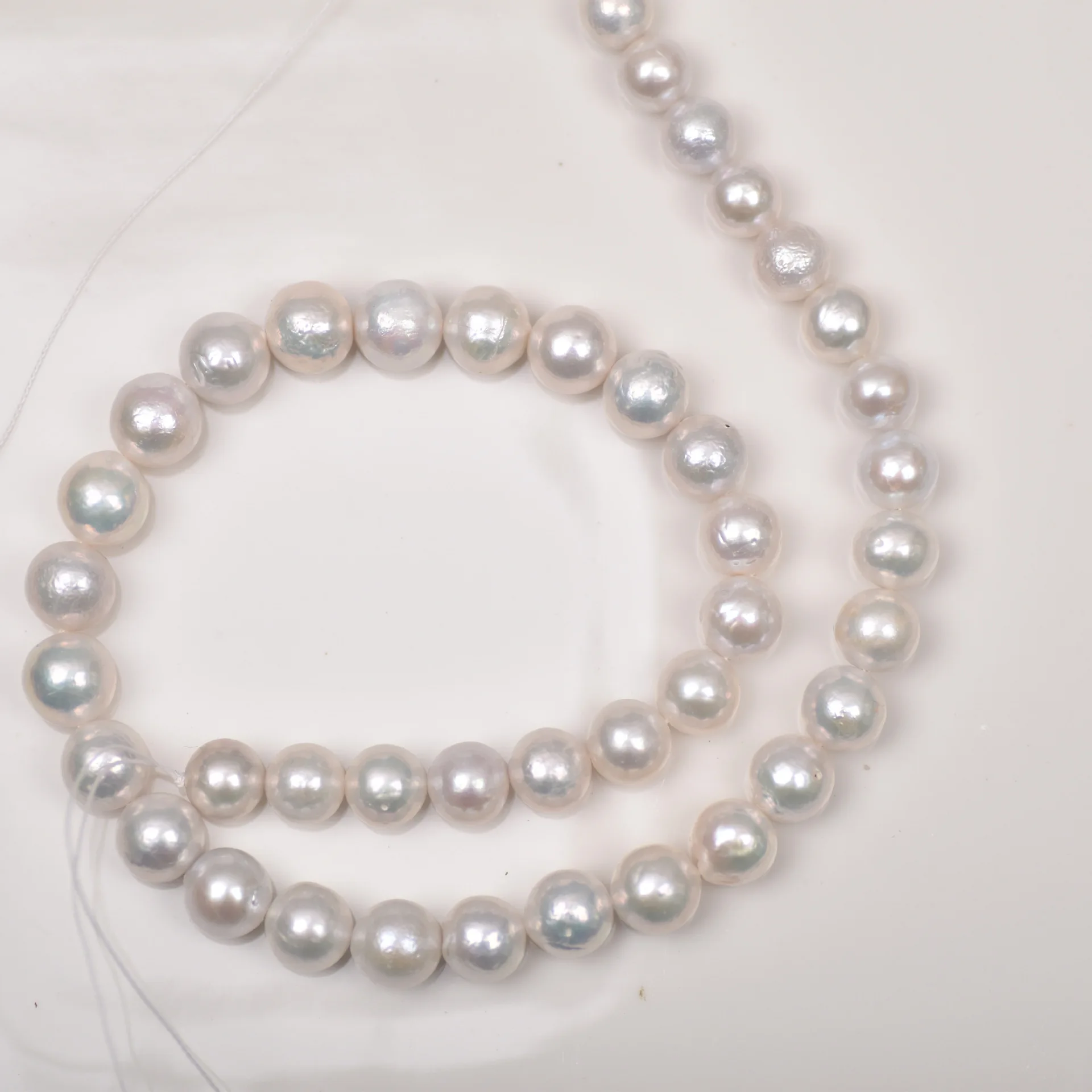 

China Cultured Natural Freshwater Pearl String Wholesale Bulk Round 10-11mm White Freshwater Pearls For Jewelry Making