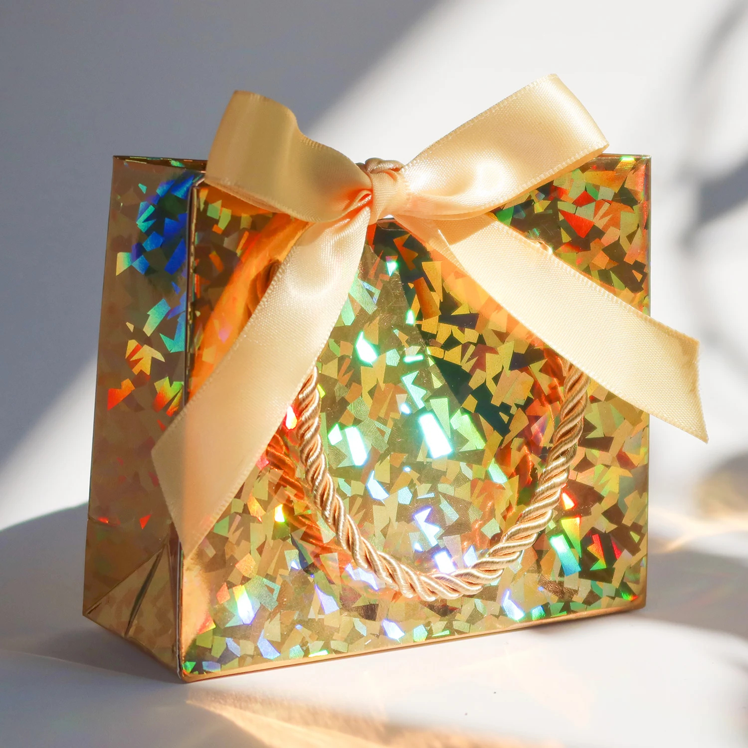 

Laser gift paper bag holiday party gold and silver packaging carton ribbon small paper bag