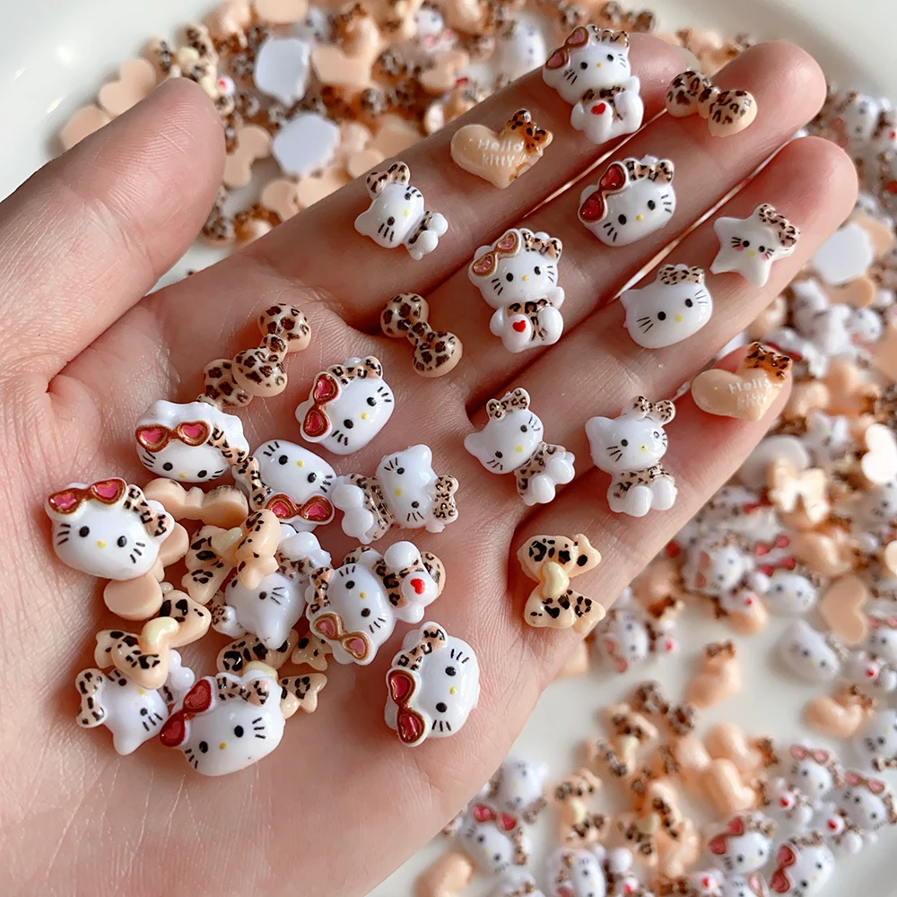 20pcs น่ารักเสือดาวแว่นตากันแดด Hello Kitty เล็บ Charms,ผสมเสือดาวพิมพ์ 3D ริบบิ้นโบว์อุปกรณ์เสริมการ์ตูนตกแต่งเล็บ