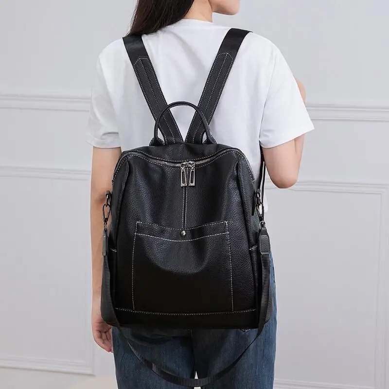 

A Backpack with Two Zippers That Can Be Opened A Large Capacity Multifunctional Backpack Made of Waterproof Leather for Students
