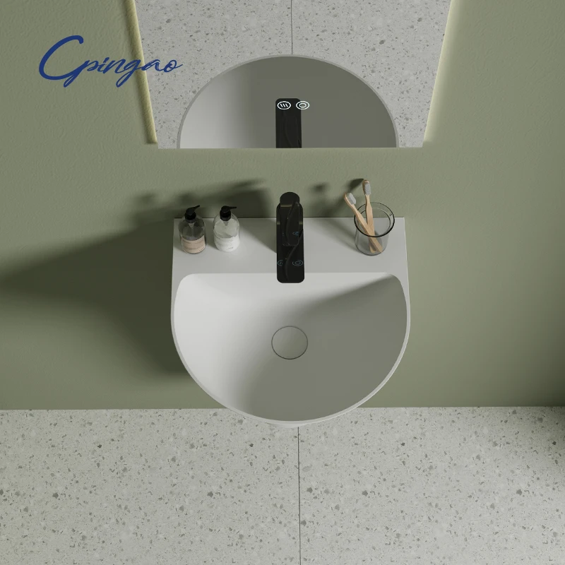 Nowoczesna owalna umywalka łazienkowa z umywalką nablatową z tworzywa sztucznego PMMA, montowana na ścianie, z odpływem, do użytku hotelowego.