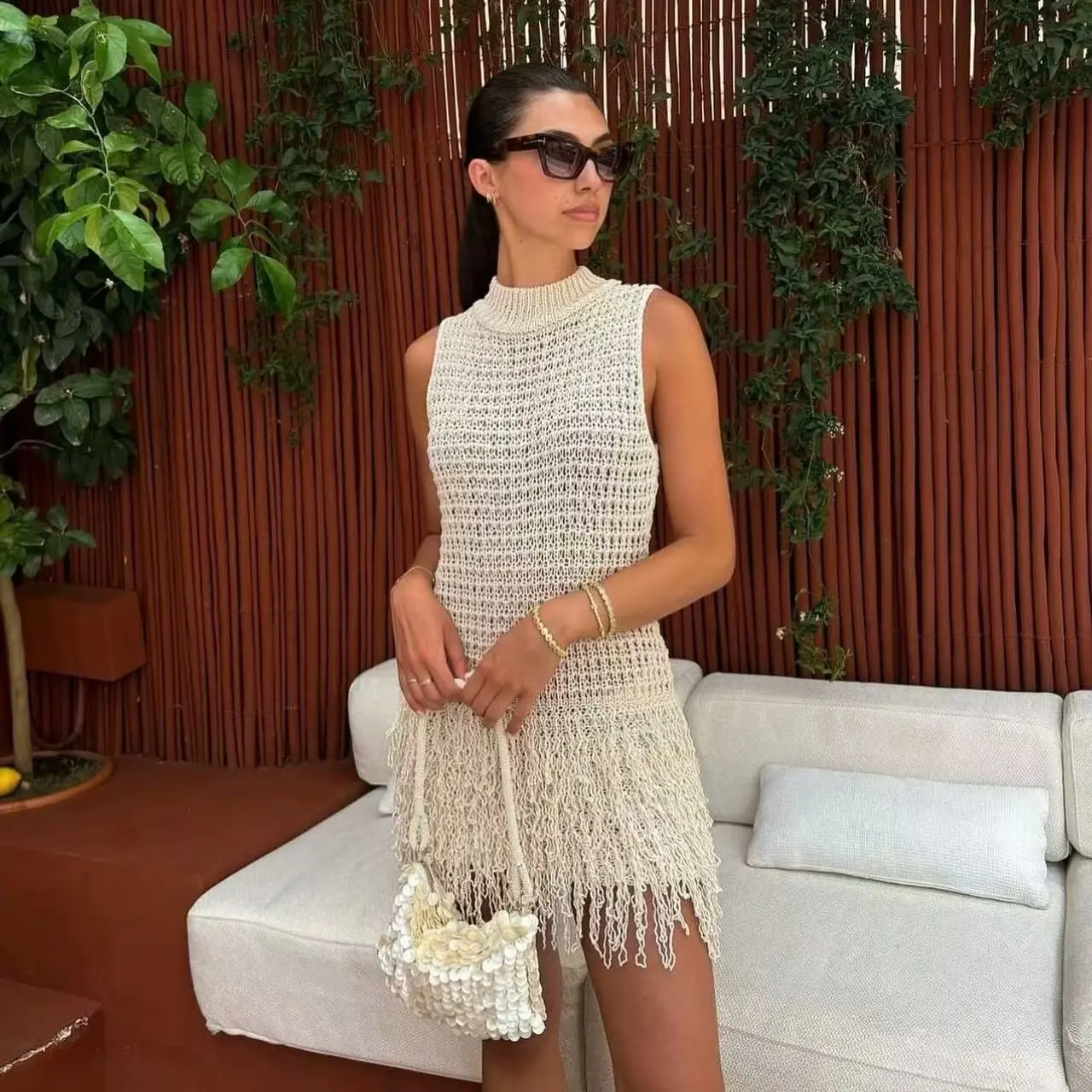 

2026 Autumn New Women's Knitted Vest Dress With Tassel Decoration Sleeveless Round Neck Hollow Short Dress Pure Desire 1ZQT