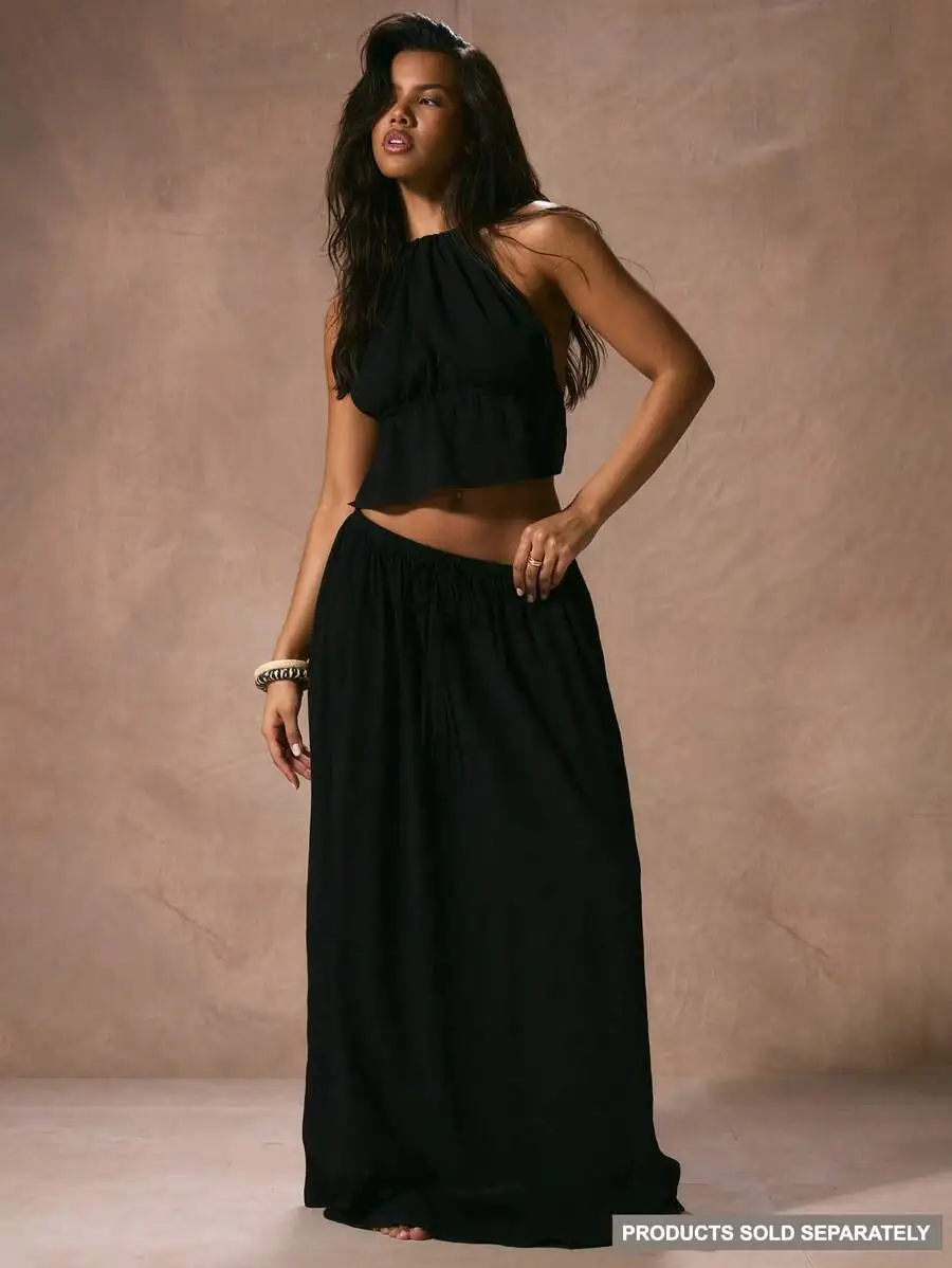 

Черная струящаяся юбка макси с завязками на талии для пляжного отдыха