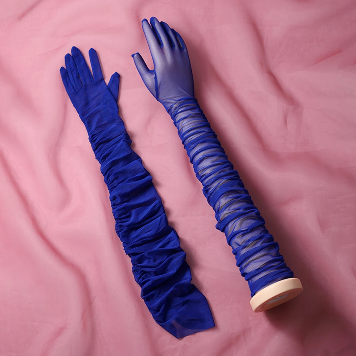 A pair of long fingered gloves, suitable as accessories for bride weddings or women's dances