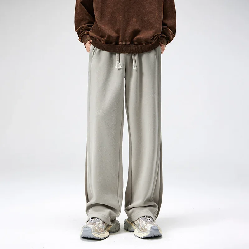 

Мужские спортивные штаны Широкие брюки Длинные брюки Повседневные свободные шнуровки с эластичной резинкой на талии Простые осенне-зимние прямые мужские брюки Новые