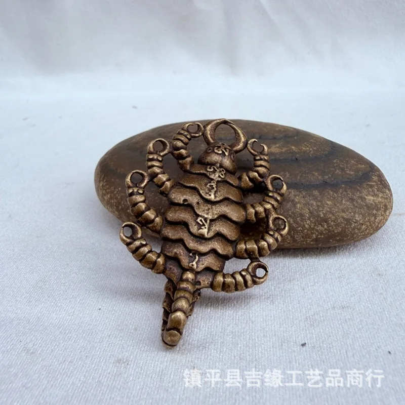 Tibetan-style brass scorpion pendant, featuring a wrathful deity from Tibet and Nepal, a nine-headed scorpion, and a copper scor