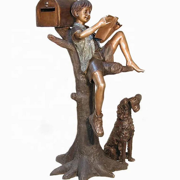 Outdoor garden metal decoration bronze sculpture of a young boy reading next to a mailbox in a tree