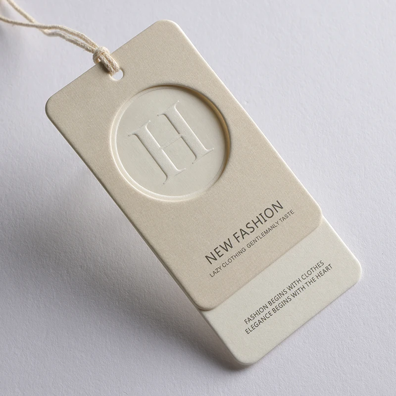 

Custom Embossed Brand Swing Hang Tags 500gsm Cotton Paper, Luxury Personalized Clothing Price Labels Custom Tags