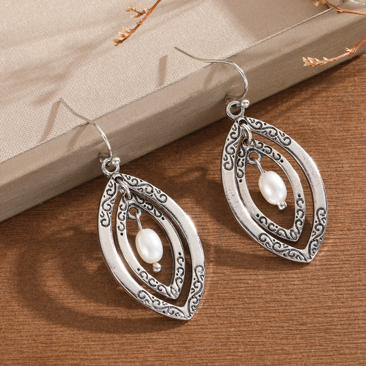 Ethnic style double-layer elliptical frame relief pattern combined with imitation pearl ladies' pendant earrings for parties